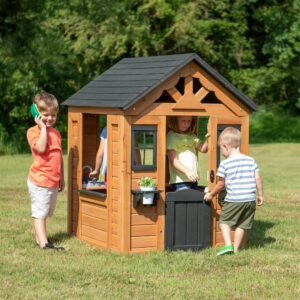 Backyard Discovery Sweetwater cedar playhouse installed package